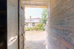 Bloom-Ranch-White-House-Rusted-Shacks-Image-_001