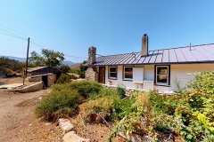 Bloom-Ranch-White-House-Rusted-Shacks-Image-_002