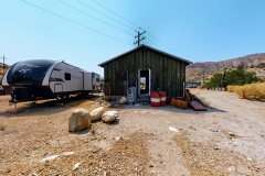 Bloom-Ranch-White-House-Rusted-Shacks-Image-_050